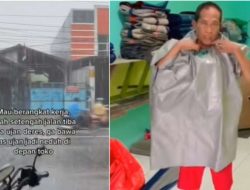 Berteduh Saat Hujan, Wanita Ini Dibuatkan Jas Hujan Oleh Penjual Terpal
